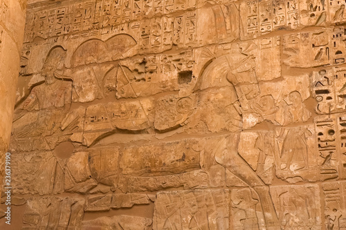 Egyptian hieroglyphs and drawings on the walls and columns. Egyp