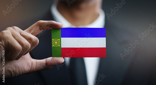 Businessman Holding Card of Khakassia Flag photo