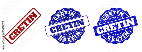 CRETIN scratched stamp seals in red and blue colors. Vector CRETIN watermarks with grainy effect. Graphic elements are rounded rectangles, rosettes, circles and text titles.