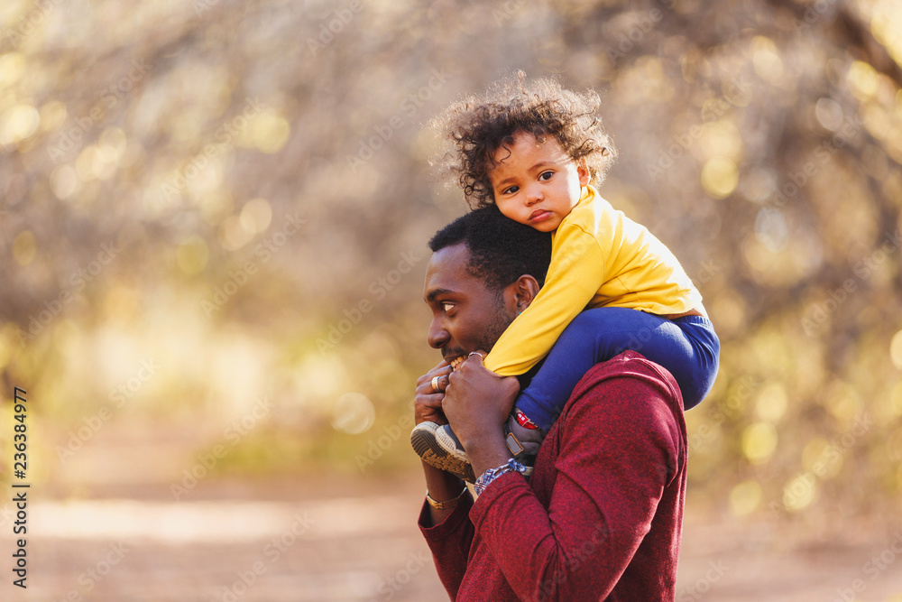 Portrait of happy african dad little boy in the garden. Portrait of happy african dad little boy in the garden.