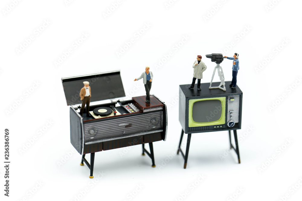 Miniature people : the small team of tv reporter of Audio Speakers, production television concept. Miniature people : the small team of tv reporter of Audio Speakers, production television concept.