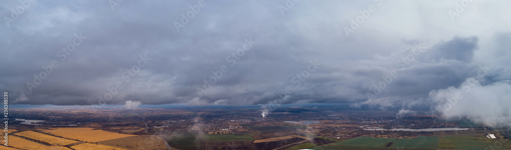Obraz premium View from the height of the city through the clouds
