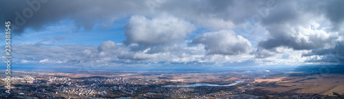 View from the height of the city through the clouds © Vidima studio MAX