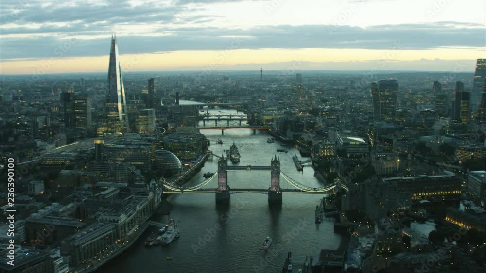 Aerial distant sunset view of the River Thames and city skyline of London UK