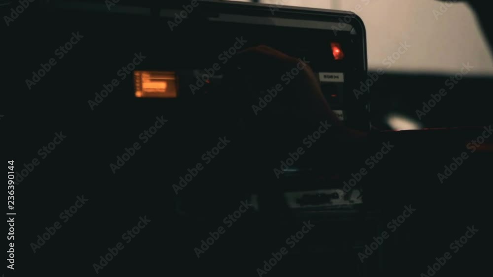 Adjusting live audio levels - Audio tech adjusts knobs on live concert amplifier before the show during sound check Adjusting live audio levels - Audio tech adjusts knobs on live concert amplifier before the show during sound check