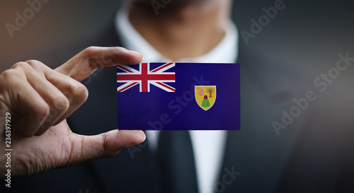 Businessman Holding Card of Turks and Caicos Islands Flag