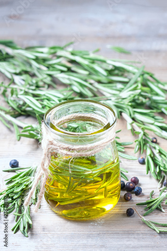 Bottle of extra virgin olive oil with rosemary.