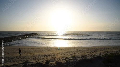 Fade in from the shadow to the beach. photo