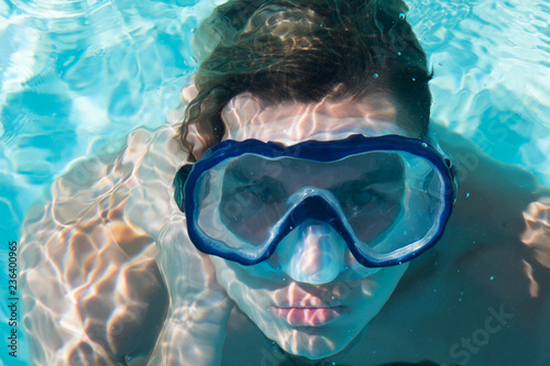 Man under water. Vacation and holidays.