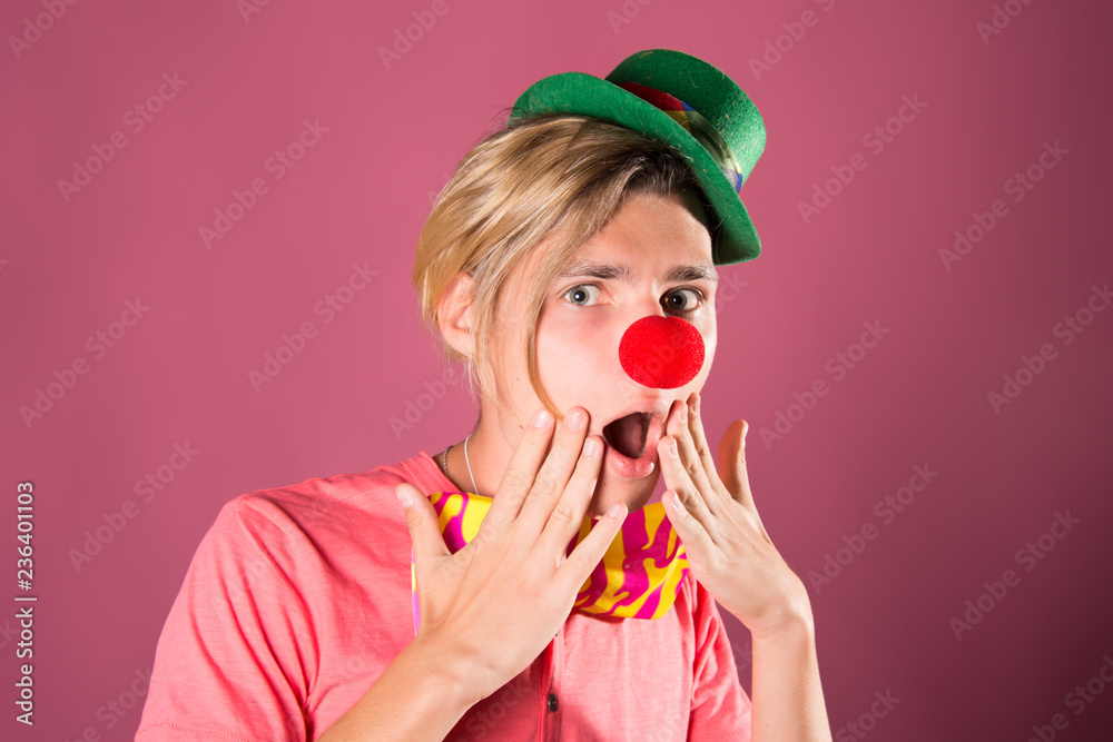 Young funny clown. Red background.
Young funny clown. Red background.