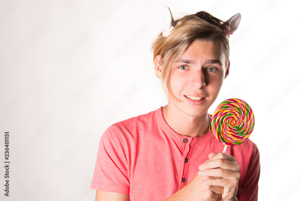 Young attractive guy and sweet candy. Young attractive guy and sweet candy.