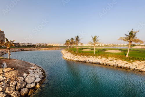 September 12, 2017 - Al Hamra Village in Ras al Khaimah, United Arab Emirates. Modern arabian village with houses and palms on Persian gulf shore.