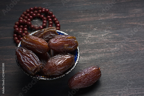 Dates fruit and rosary still life