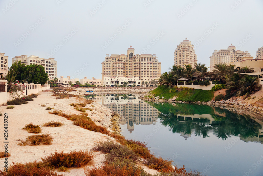 September 16, 2017 - Al Hamra Village in Ras al Khaimah, United Arab Emirates. Modern arabian district area with apartment buildings, palms and hotels in Persian gulf.