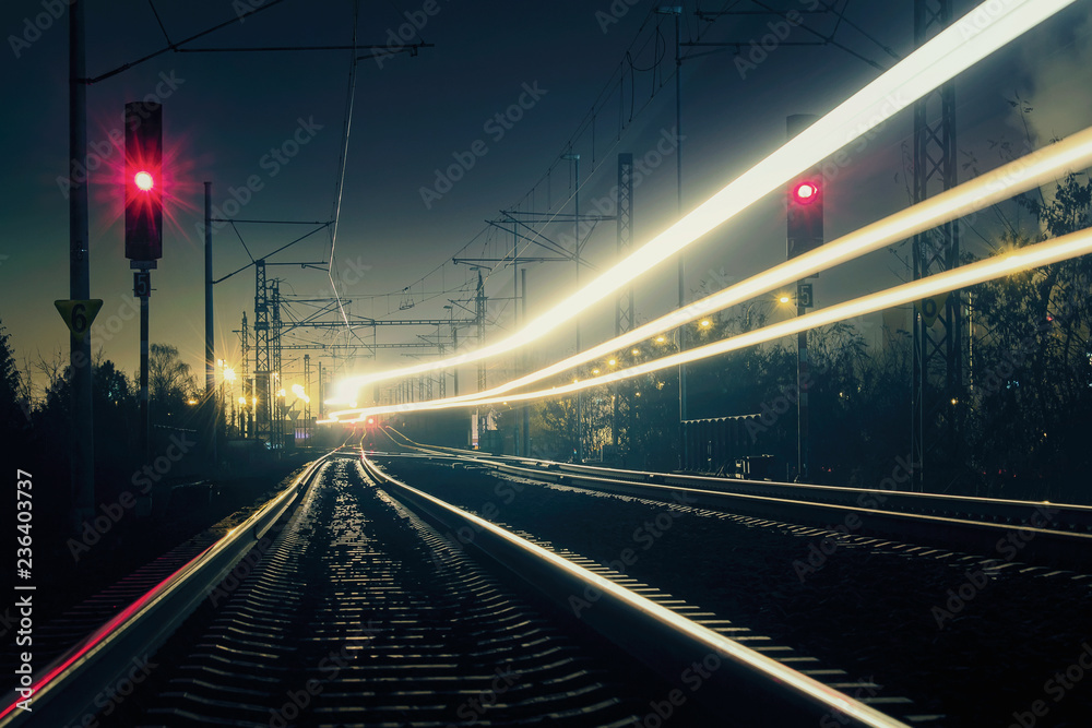Train light trail with red light, long exposure Train light trail with red light, long exposure