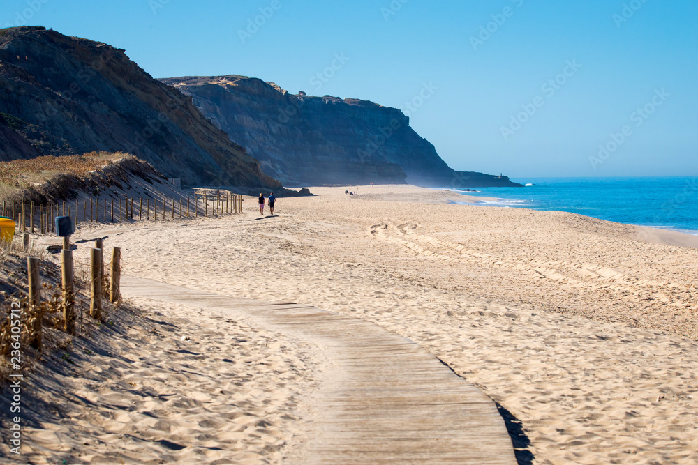 Wooden path on sand to sea. Vacation and rest on a beach concept