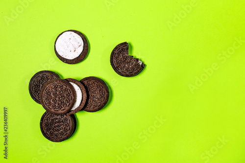 Oreo cookies, Chocolate cream filling sandwich cookies on a green background photo