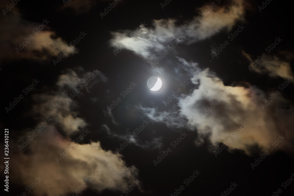 Crescent in the dark cloudy sky Crescent in the dark cloudy sky