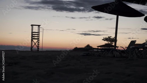 timelapse sunset rescue point on the beach photo