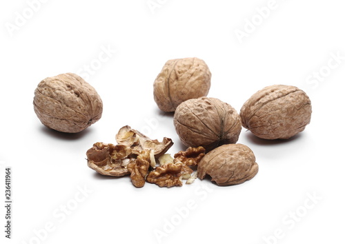 Cracked walnuts, isolated on white background