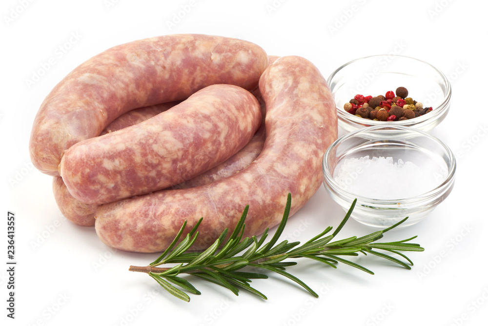 Raw Sausages from pork, spiral sausages with herbs and spices, isolated on a white background. Close-up.