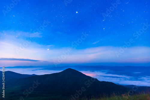 Clear blue sky with mountain and misty flow © Nattawut