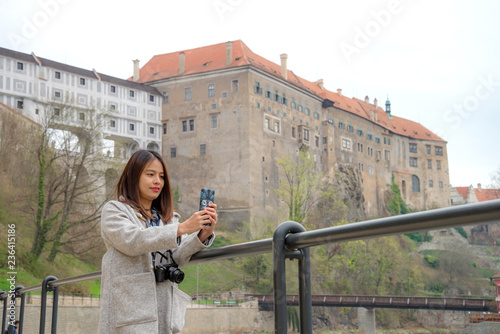 A woman tourist sightseeing at Cesky Krumlov Castle , Czech © Napatsan