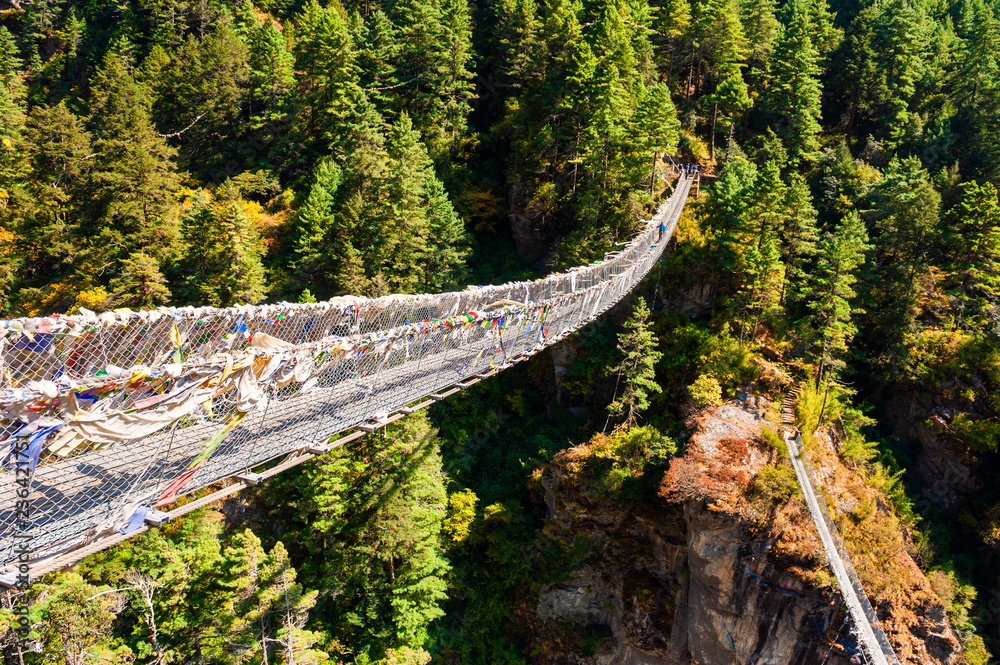 Suspension bridge over the river in Himalaya mountains, Nepal. Everest