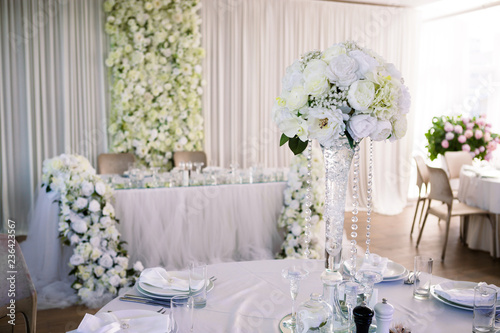 Wedding table decorated with flowers. © Olga Ev