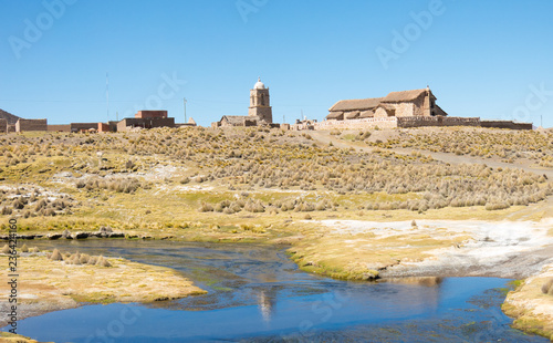 The small Andean town of Sajama, from the bank of the Sajama river. Bolivian Altiplano. Bolivia, South America