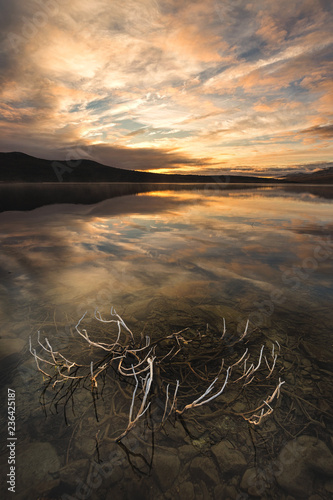 Sunrise over Hjerkinnsdammen lake, Dovre mountains. photo