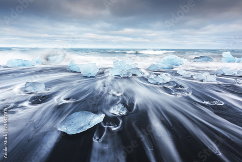 Iceberg pieces on Diamond beach near Jokulsarlon lagoon, Iceland. Landscape photography
