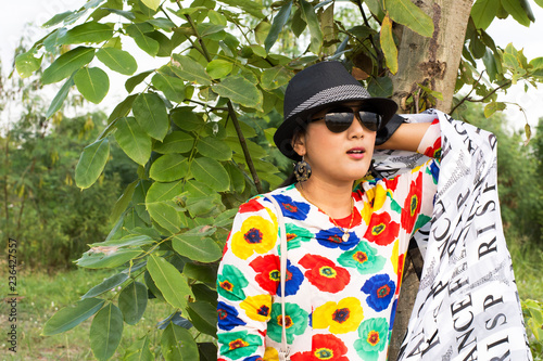 Thai woman wearing fashion colorful clothes posing portrait for take photo at outdoor