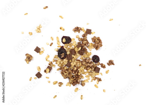 Crunchy granola, muesli with chocolate and cherry pieces isolated on white background, top view