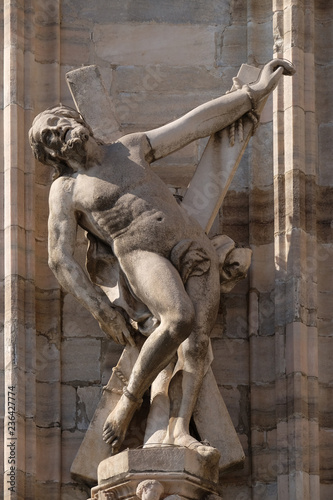 Saint Andrew the Apostle, statue on the Milan Cathedral, Duomo di Santa Maria Nascente, Milan, Lombardy, Italy photo