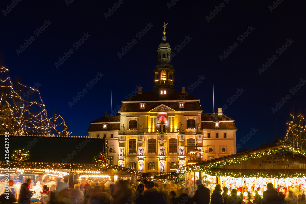 Traditional and popular Christmas market in front of the historic town hall of Lüneburg. 