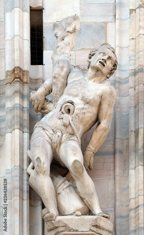 Martyrdom of Saint Erasmus, statue on the Milan Cathedral, Duomo di Santa Maria Nascente, Milan, Lombardy, Italy