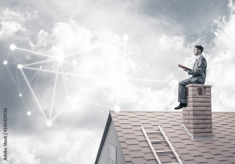 Man reading book and concept of social connection in sky Man reading book and concept of social connection in sky