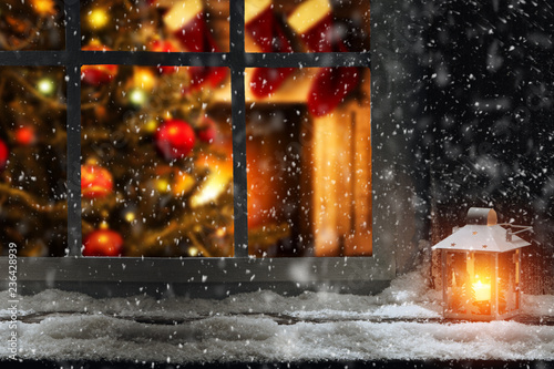 Fotografija Christmas window sill of snow and ice and home interior