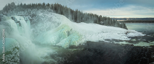 Biggest frozen swedish waterfall Tannforsen in winter time