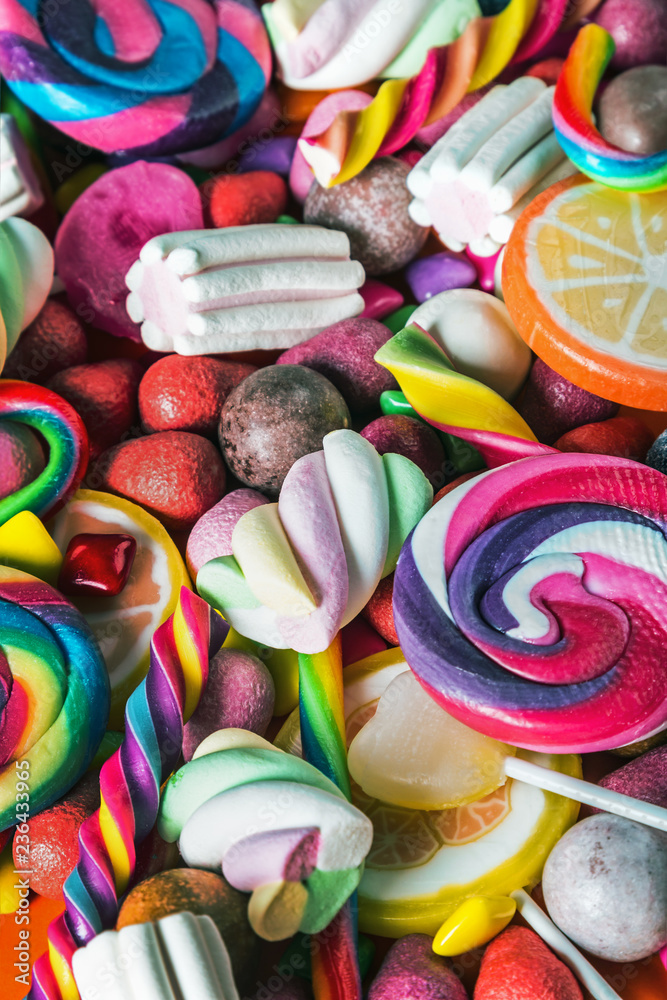 background from variety of sweets, lollipops, chewing gum, candies etc