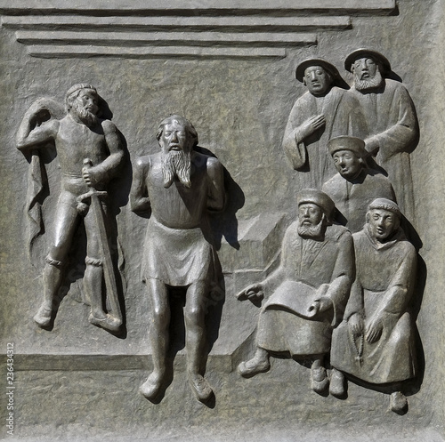 The Bailiff of Stammheim, Hans Wirth, is beheaded in Baden because of his Protestant faith, relief on the door of the Grossmunster ("great minster") church in Zurich, Switzerland