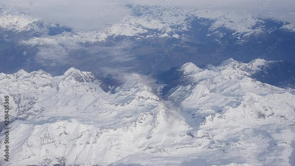 Winter mountains from Italian Alps from an plane window Winter mountains from Italian Alps from an plane window