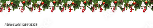 Christmas tree branches on white background as a border