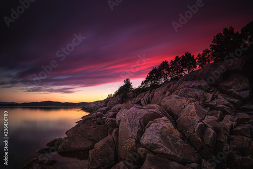 Amazing sunset light and colours by the shores of Gjerdavika, Norway. photo