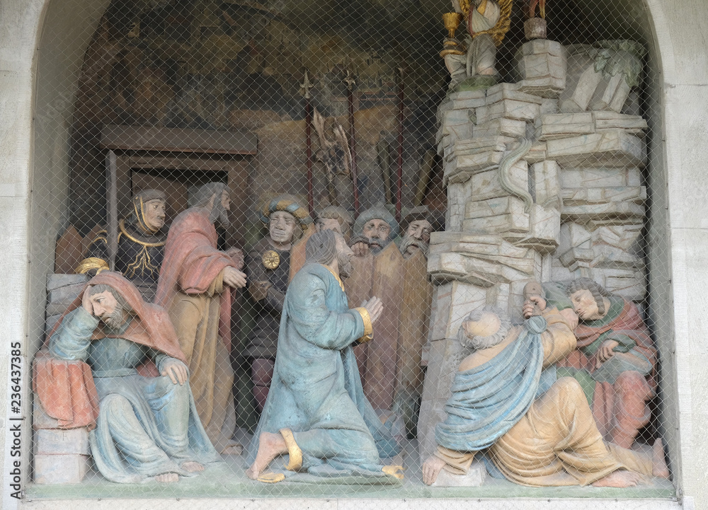Jesus on the Mount of Olives, surrounded by approaching soldiers and the Apostles, portal of the church of St. Leodegar in Lucerne, Switzerland