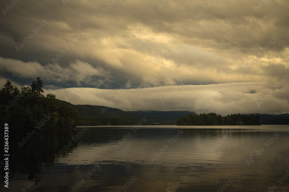 Naklejka premium Sunset sky reflections in Jonsvatnet lake, Norway.