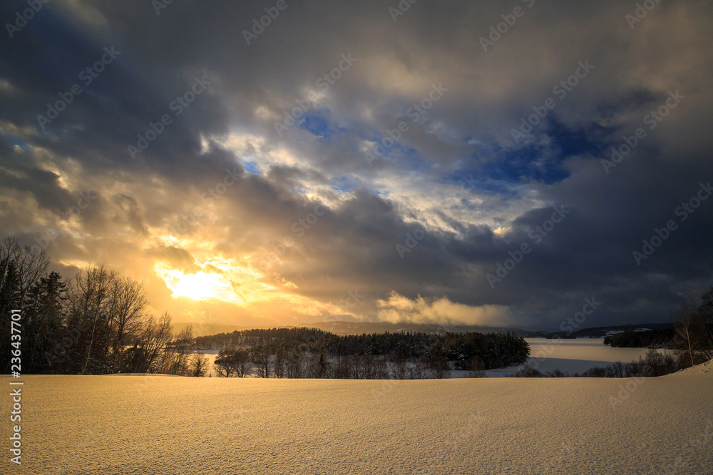 Sunset sky in winter time near Jonsvatnet lake in Norway.