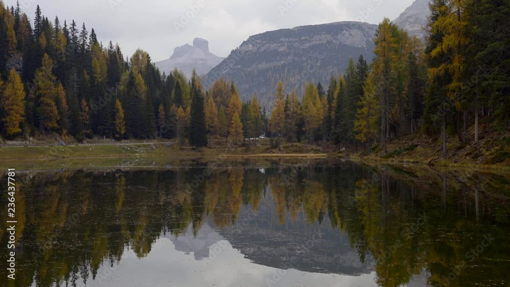 Autumn landscape of Antorno lake with famous Dolomites mountain peak of Tre Cime di Lavaredo in background in Italian Dolomites.