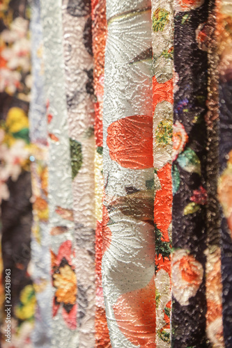  Colorful floral rolls of textile in the shop
